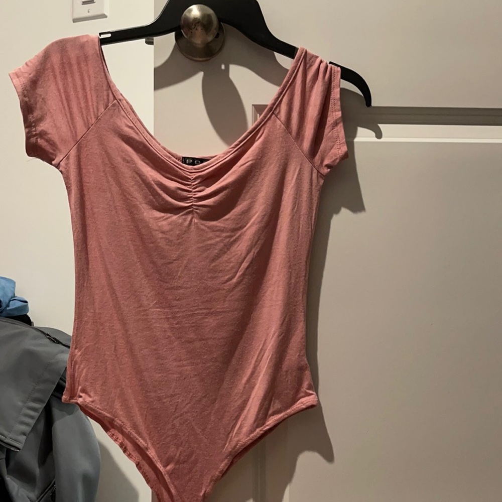 Pink body suit